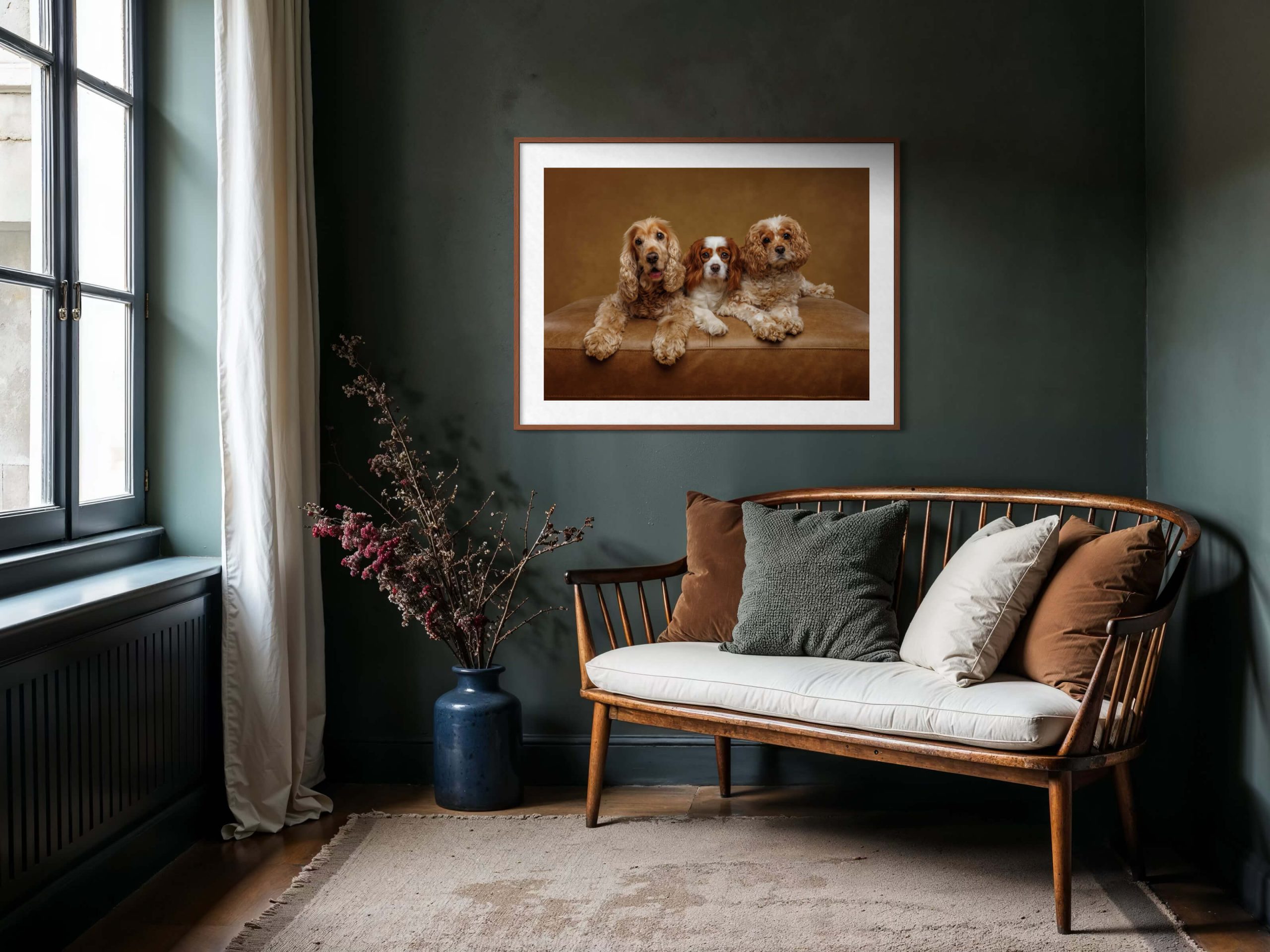 Three beautiful dogs featured in a wall portrait in a quiet reading room.